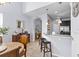 Eat-in kitchen featuring granite countertops, stainless steel appliances, and breakfast bar seating at 2221 Broadway View Ave, Brandon, FL 33510