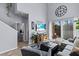 Spacious living room with a high ceiling, comfortable seating, and access to the patio at 2221 Broadway View Ave, Brandon, FL 33510