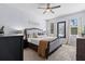 Beautifully decorated bedroom featuring natural light, soft carpet, and modern ceiling fan at 2221 Broadway View Ave, Brandon, FL 33510