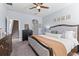 Bright Primary bedroom showcasing stylish decor, plush bedding, and ample space with great natural light at 2221 Broadway View Ave, Brandon, FL 33510