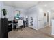 Home office area with desk setup, dual monitors, carpeted floor, and clean, modern design at 2221 Broadway View Ave, Brandon, FL 33510