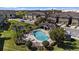 Aerial view of a community pool area featuring a sparkling pool, a cabana, and a well-kept deck at 2221 Broadway View Ave, Brandon, FL 33510