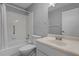Bathroom with a shower-tub combination with white tile surround and a white single sink vanity at 2411 Lancaster Dr, Sun City Center, FL 33573