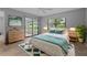 Serene bedroom with calming decor, sliding glass doors and lots of natural light at 2411 Lancaster Dr, Sun City Center, FL 33573