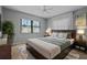 Cozy bedroom with a large window and a comfortable bed and carpet at 2411 Lancaster Dr, Sun City Center, FL 33573