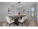 Elegant dining room featuring modern decor, stylish furnishings, and ample natural light at 2411 Lancaster Dr, Sun City Center, FL 33573