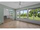 Bright living room with views of backyard, tile floors, and doorway to breakfast nook at 2411 Lancaster Dr, Sun City Center, FL 33573