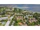 Aerial view of residential community featuring a golf course and waterfront views in a desirable neighborhood at 2934 Lichen Ln # A, Clearwater, FL 33760