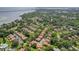 Aerial view of residential community near a bay with mature trees and lush landscaping creating a serene and inviting neighborhood at 2934 Lichen Ln # A, Clearwater, FL 33760