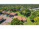 An aerial view of townhomes, showcasing the surrounding trees and greenery at 2934 Lichen Ln # A, Clearwater, FL 33760