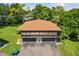 Aerial view of a townhome building featuring a well-maintained lawn at 2934 Lichen Ln # A, Clearwater, FL 33760