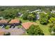 An aerial view of townhomes surrounded by trees and landscaping at 2934 Lichen Ln # A, Clearwater, FL 33760