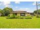 Exterior view of home showcasing landscaping and lawn at 2934 Lichen Ln # A, Clearwater, FL 33760