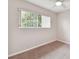 Neutral bedroom featuring a fan, carpet, and a window with blinds at 2934 Lichen Ln # A, Clearwater, FL 33760