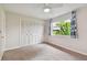 Bright bedroom with closet doors and a window at 2934 Lichen Ln # A, Clearwater, FL 33760