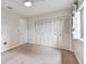 Bedroom with carpet, a window, closet doors, and a white door at 2934 Lichen Ln # A, Clearwater, FL 33760