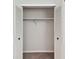 A basic closet with bi-fold doors and a single shelf with a hanging rod at 2934 Lichen Ln # A, Clearwater, FL 33760