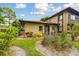 Home's exterior with landscaped front yard and walkway at 2934 Lichen Ln # A, Clearwater, FL 33760