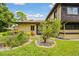 Exterior view of home with lush landscaping and green lawn at 2934 Lichen Ln # A, Clearwater, FL 33760