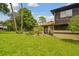 A well maintained home featuring a large green front yard and mature trees in a quiet neighborhood at 2934 Lichen Ln # A, Clearwater, FL 33760