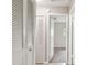 Hallway featuring a closet, neutral walls, and access to a carpeted bedroom at 2934 Lichen Ln # A, Clearwater, FL 33760
