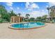 Tranquil pool setting surrounded by palm trees and comfortable seating, creating a perfect oasis for relaxation at 2934 Lichen Ln # A, Clearwater, FL 33760