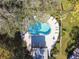 Birds-eye view of a pristine pool surrounded by well-manicured landscaping and ample space for lounging at 2934 Lichen Ln # A, Clearwater, FL 33760