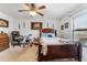 Spacious bedroom with ceiling fan, window, and room for various furniture at 30475 Satinleaf Run, Brooksville, FL 34602