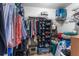 Walk-in closet featuring ample storage with shelves, hanging racks, and containers at 30475 Satinleaf Run, Brooksville, FL 34602