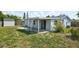 Spacious backyard with covered patio perfect for entertaining guests at 3207 Coldwell Dr, Holiday, FL 34691