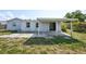 This home features a spacious backyard and covered patio at 3207 Coldwell Dr, Holiday, FL 34691