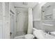 This full bathroom features a shower, sink, toilet and linen closet at 3207 Coldwell Dr, Holiday, FL 34691