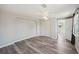This bedroom boasts wood-look flooring, neutral paint and a double closet for optimal storage at 3207 Coldwell Dr, Holiday, FL 34691
