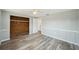 Spacious bedroom features hardwood floors, wooden closet, and ample sunlight at 3207 Coldwell Dr, Holiday, FL 34691