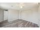 Bedroom with wood-look floors, neutral walls, and white trim at 3207 Coldwell Dr, Holiday, FL 34691