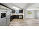 Modern kitchen features stainless steel appliances, dark cabinets, and lots of natural light at 3207 Coldwell Dr, Holiday, FL 34691