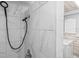 Updated shower featuring sleek tile, modern fixtures, and a handheld shower head at 3543 Rockaway Dr, Holiday, FL 34691
