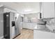 Updated kitchen featuring stainless steel appliances and granite countertops at 3543 Rockaway Dr, Holiday, FL 34691