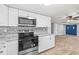 Well-equipped kitchen with granite countertops, stainless steel appliances, and tile backsplash at 3543 Rockaway Dr, Holiday, FL 34691