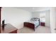 Bedroom featuring neutral carpet, a window, and dark wood furniture at 35646 Eastbrook Ave, Zephyrhills, FL 33541