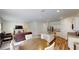 Open-concept layout featuring a seamlessly connected kitchen, dining, and living area at 35646 Eastbrook Ave, Zephyrhills, FL 33541