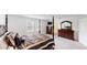 Expansive main bedroom with a four-poster bed and modern furnishings at 35646 Eastbrook Ave, Zephyrhills, FL 33541