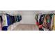Spacious walk-in closet with ample hanging space and shelving, offering plenty of storage for clothing and accessories at 35646 Eastbrook Ave, Zephyrhills, FL 33541