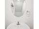 Bathroom vanity with a neutral paint color and oval mirror at 36727 Spanish Rose Dr, Dade City, FL 33525