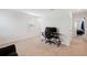 Bedroom featuring carpet floors, a gaming setup, and access to the hallway at 36727 Spanish Rose Dr, Dade City, FL 33525