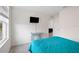 This bedroom features bright walls, carpet flooring, and an ensuite bathroom at 36727 Spanish Rose Dr, Dade City, FL 33525