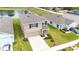 Charming two-story home features a neutral color palette, attached garage, and a well-manicured lawn at 36727 Spanish Rose Dr, Dade City, FL 33525
