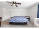 Bright main bedroom with carpet floors, ceiling fan, and ensuite bathroom access at 36727 Spanish Rose Dr, Dade City, FL 33525