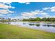 Community view of the pond in a desirable neighborhood at 36727 Spanish Rose Dr, Dade City, FL 33525