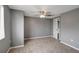 Bedroom features neutral carpet and paint at 4111 Stratfield Dr, New Port Richey, FL 34652